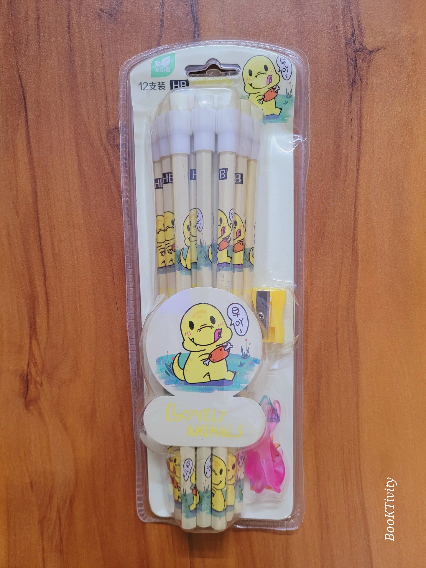 12 HB pencils with erasers on the top sharpner and pencil holder one set